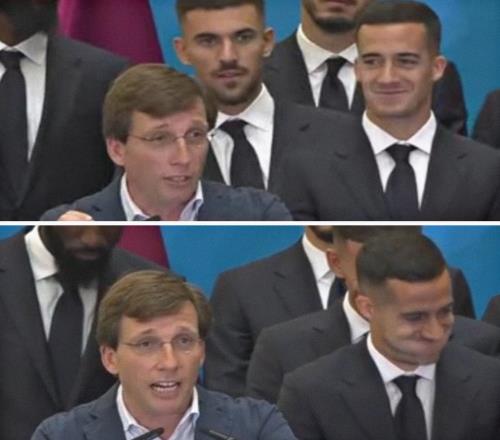 注意形象马德里市长在前面讲话，巴斯克斯在身后失去表情管理
